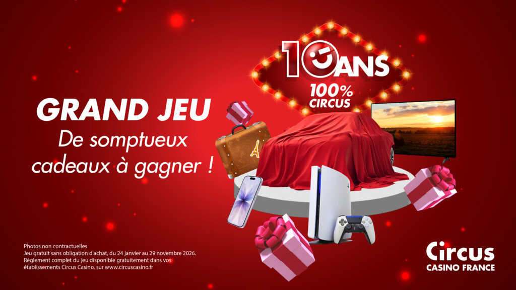10 ans 100% Circus, sur une enseigne lumineuse évoquant Las Vegas, au dessus de cadeaux, d'une console de jeux, d'une valise, GRAND JEU - de somptueux cadeaux à gagner